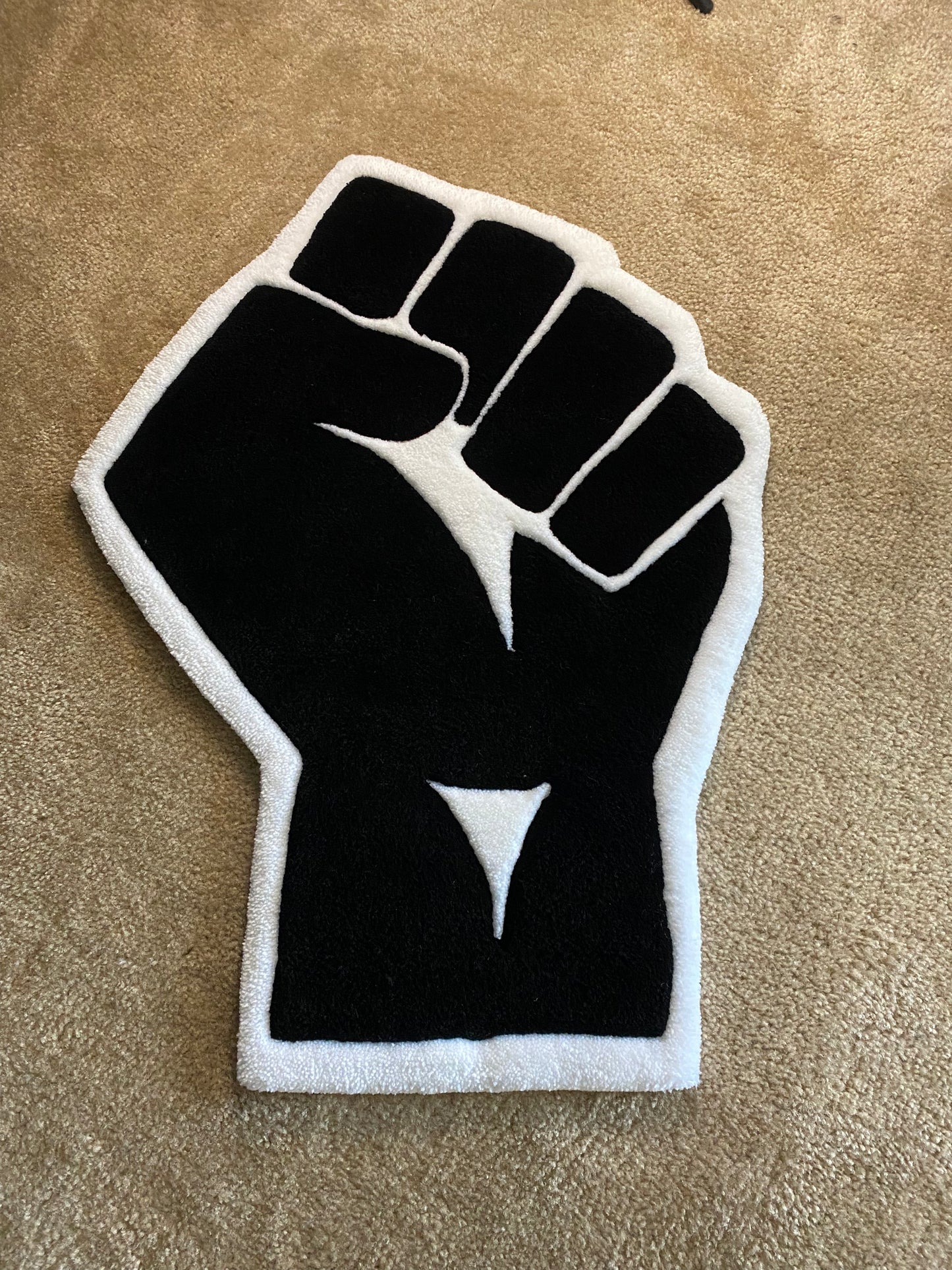 Raised Fist Rug